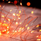 QITONG 4 Pack Orange Solar Fairy Lights, Each 33ft 100 LED Halloween Lights Outdoor Waterproof, 8 Modes Copper Wire Mini String Lights