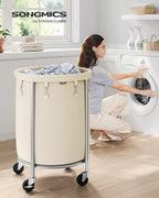 SONGMICS 29-Gallon (110 L) Laundry Basket with Wheels, Rolling Round Heavy-Duty Laundry Hamper Cart with Steel Frame and Removable Bag, 2 Locking Wheels, Cream White and Metallic Silver URLS002W01