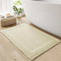 RESARE Waffle Bath Mat for Bathroom, Super Absorbent Bathroom Rugs Non Slip Machine Washable, Ultra Soft Quick Dry Boho Bath Rugs with Tassels for Floor, Upgraded Bordered Design, 18"x30" Cream