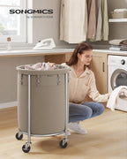 SONGMICS 29-Gallon (110 L) Laundry Basket with Wheels, Rolling Round Heavy-Duty Laundry Hamper Cart with Steel Frame and Removable Bag, 2 Locking Wheels, Camel Brown and Metallic Silver URLS002N01